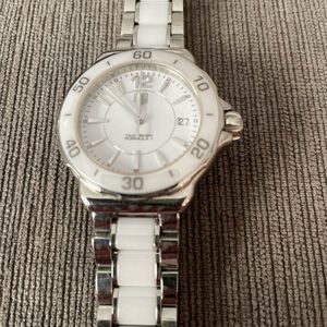 Woman’s, Tag Heuer, white quartz, watch.